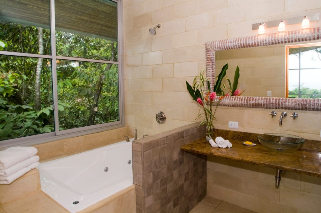 All ten bathrooms feature unique designs with different colors of stone and tile. 