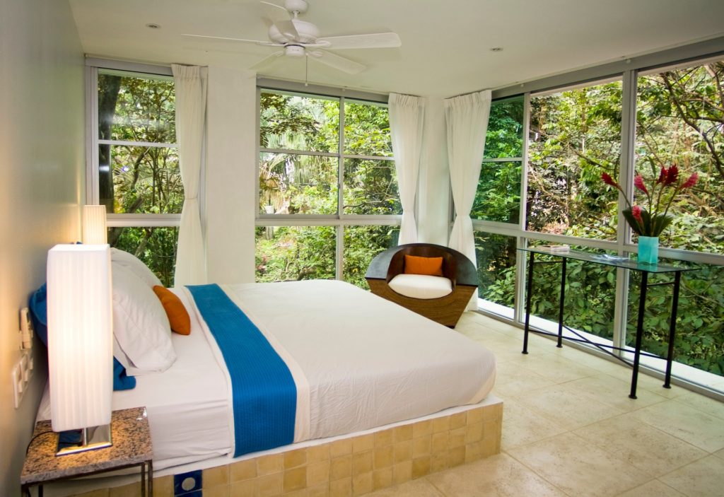 You will feel like you are part of the jungle in this bedroom with a wrap-around rainforest view. 