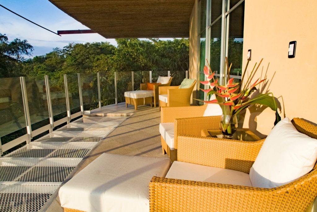 The upper-level terrace is one of many spaces to relax and quietly enjoy the views in a comfortable setting.