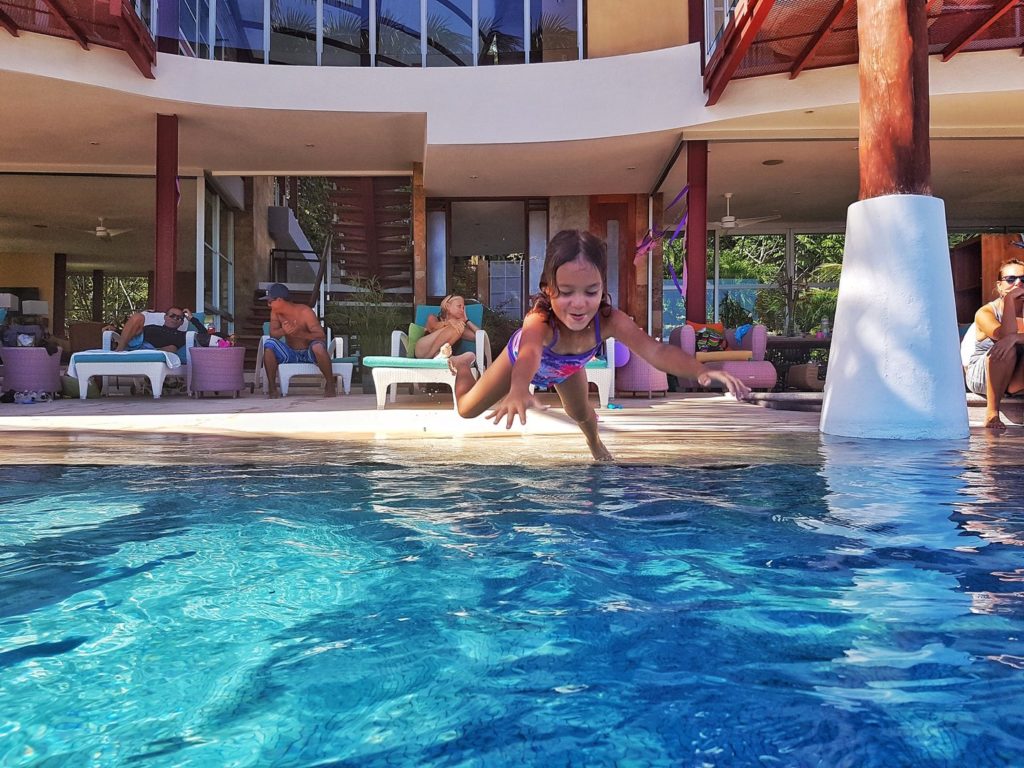 Enjoying time as a family poolside is a perfect way to spend your vacation.