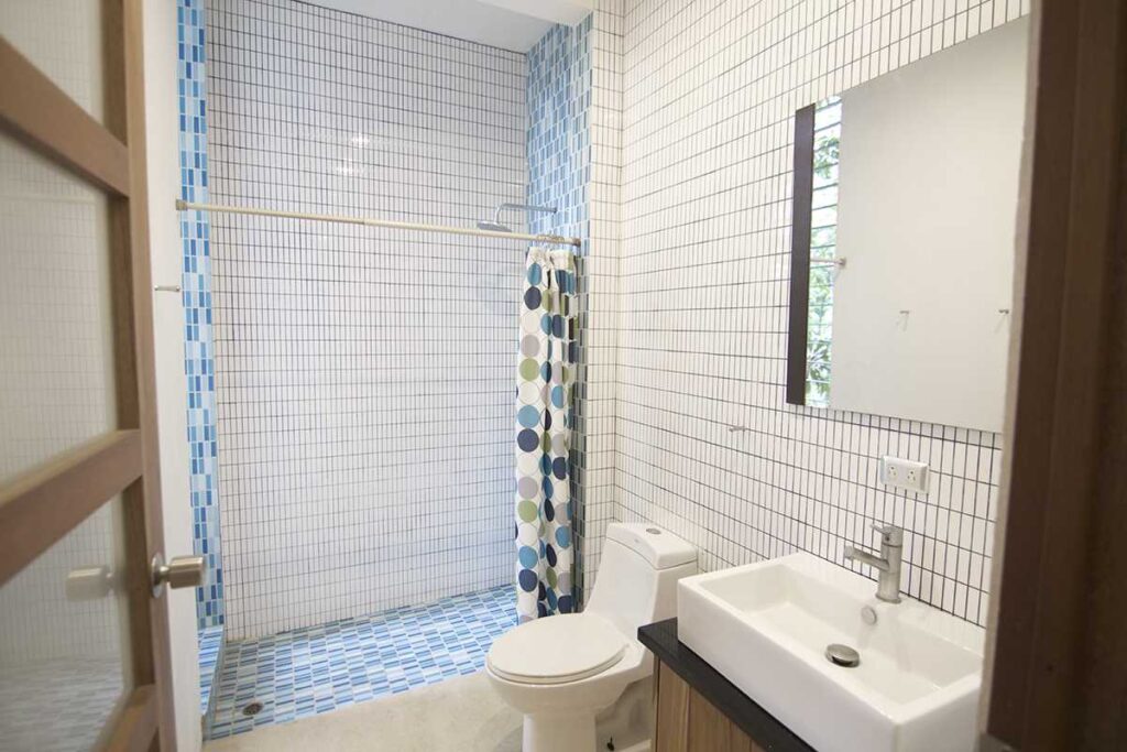 The studio apartment has a full bathroom with shower. This Manuel Antonio vacation home can sleep up to eight guests.