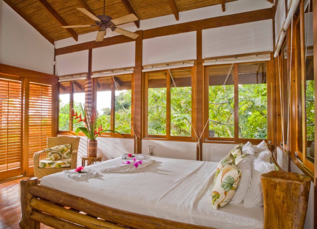 This bedroom features a fantastic jungle and ocean view. All five bedrooms have air conditioning.