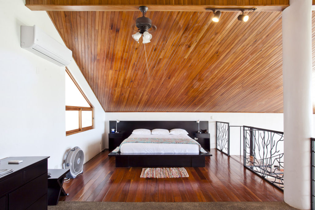 The dramatic contemporary king bed in the large loft.
