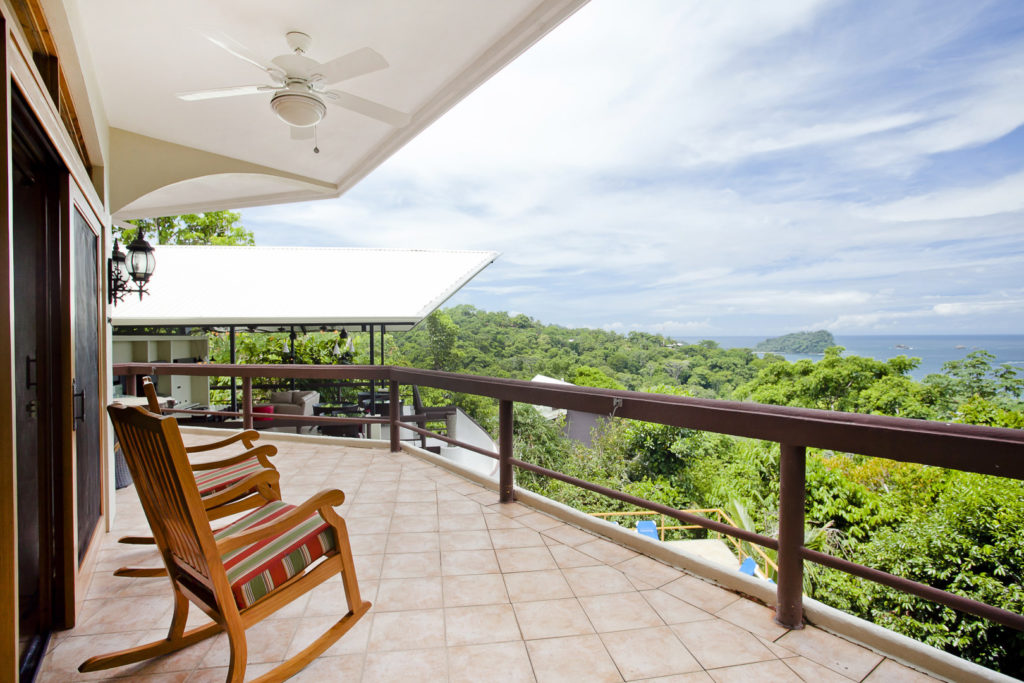 This balcony outside the living room is huge and a great place to entertain, overlooking the pool and ocean.