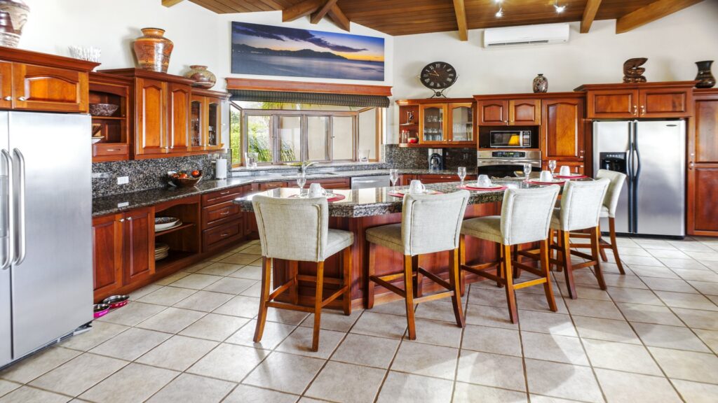 This kitchen area offers the space and all the amenities to use. The kitchen area can be the focal point for large families.