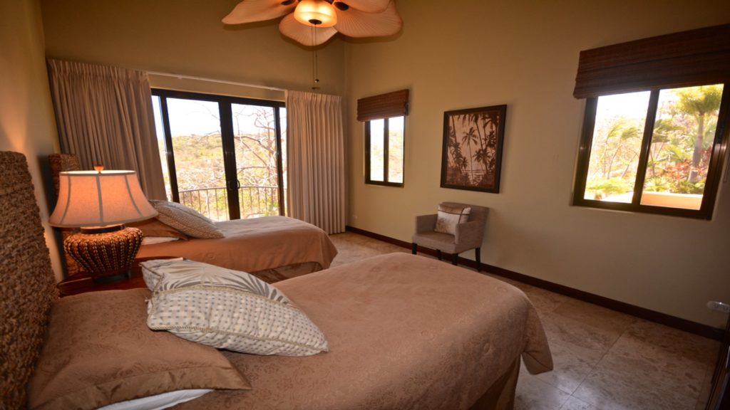 Choices are what will be needed for an exhilarating nights sleep. This bedroom offers 2 regal beds and outdoor views, while relaxing under the ceiling fan at papagayo.