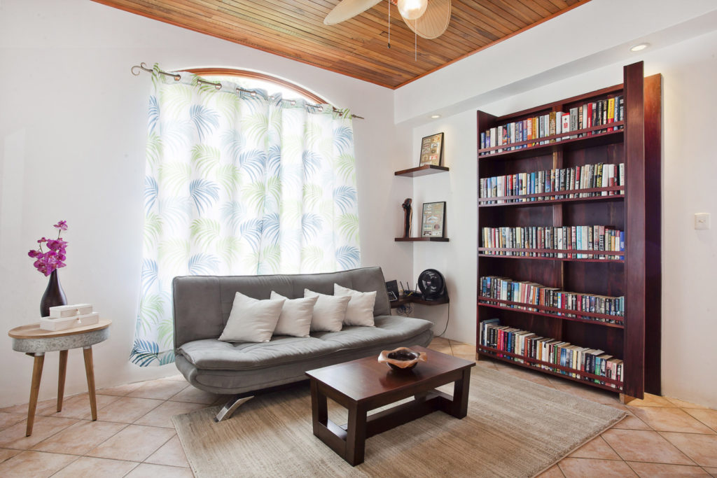 This quiet reading room next to the master bedroom has a great supply of books to enjoy.