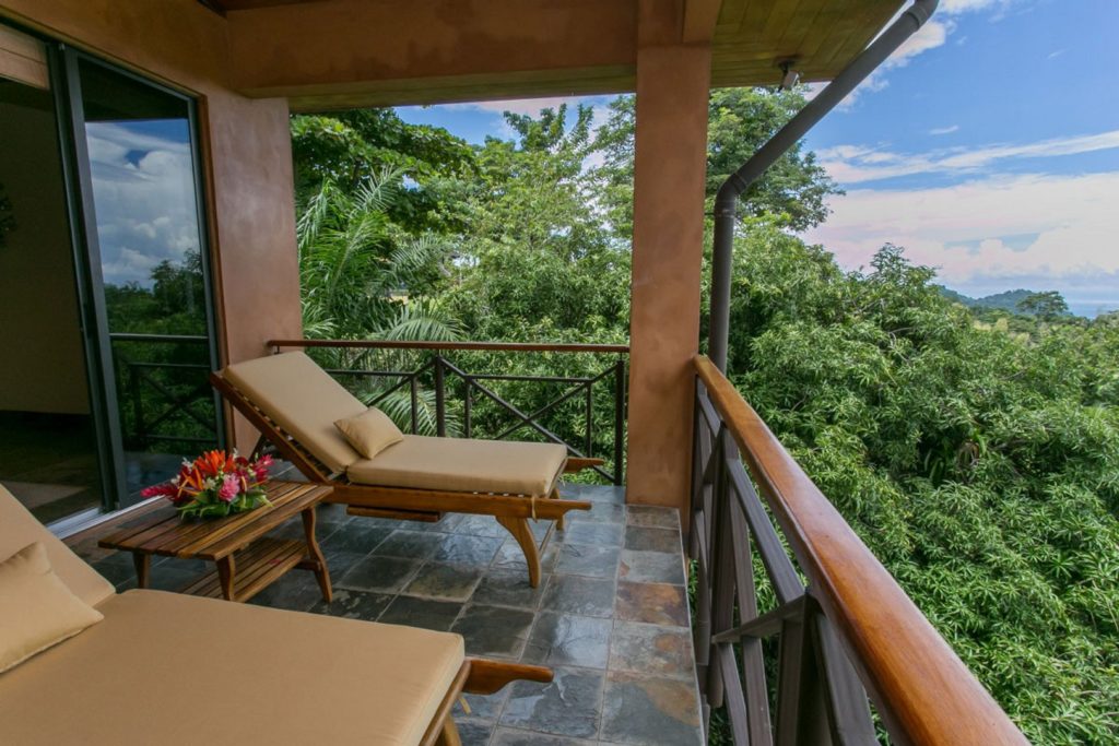 Lay back and take in the tropical ocean breeze on your private balcony.