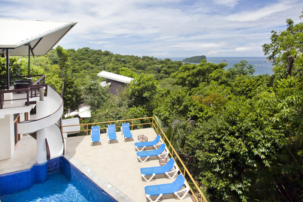 The pool and sun deck hang over the lush rainforest canopy with breathtaking views in every direction.