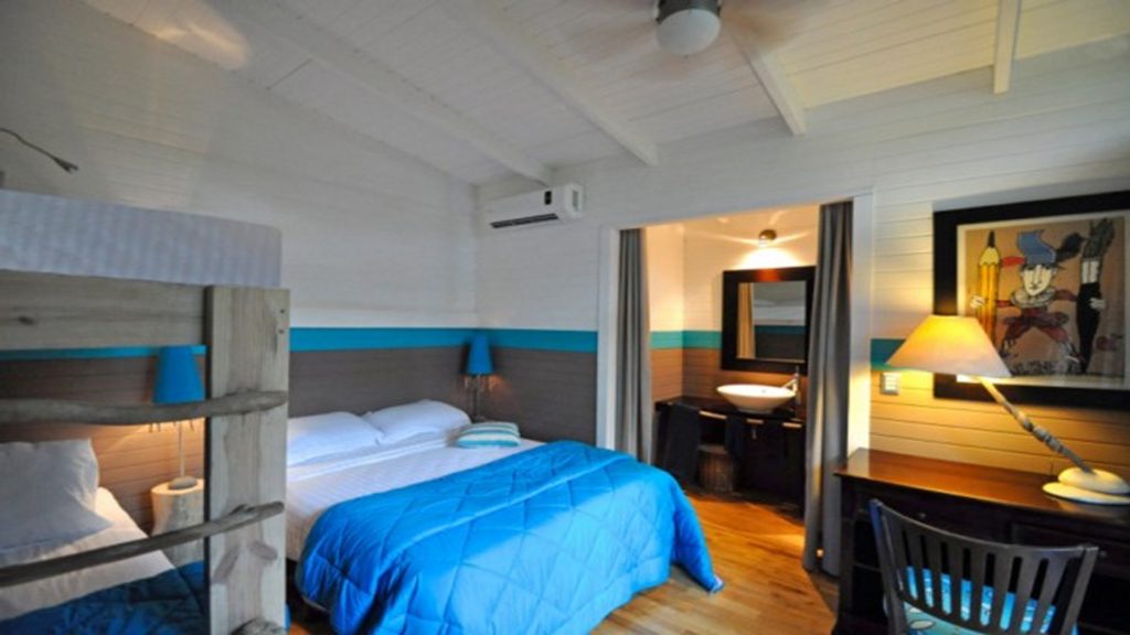The air-conditioned guest bedroom at TA-26 features a full size bed, twin bunks and an en-suite bath. 