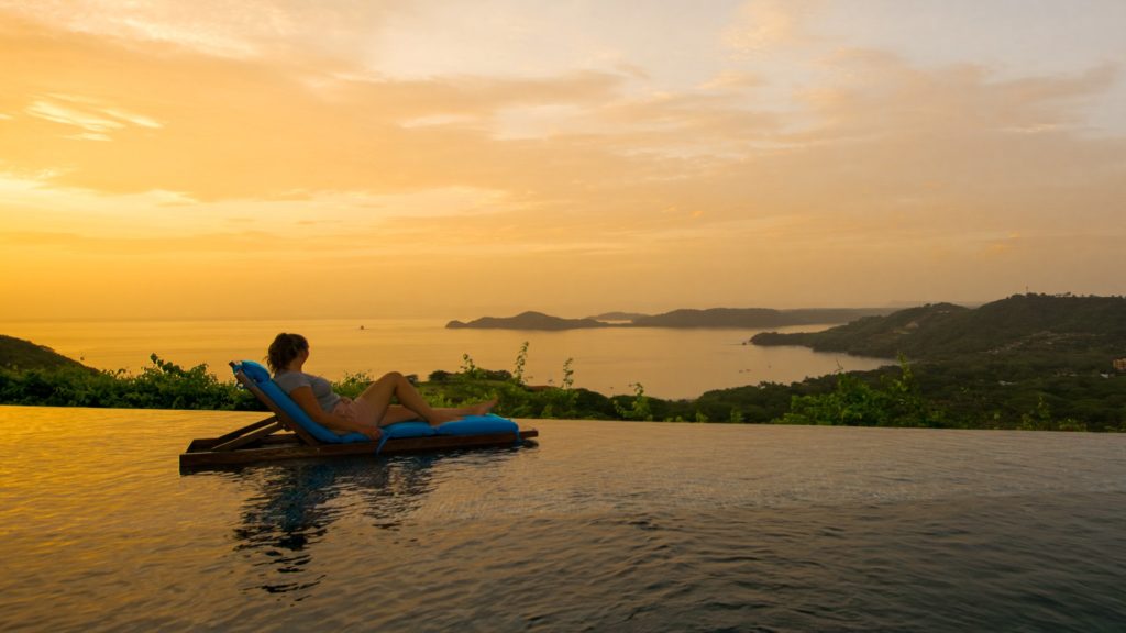 Lounge poolside along the water&apos;s edge. The pool area is refreshing with beautiful views at Papagayo. 