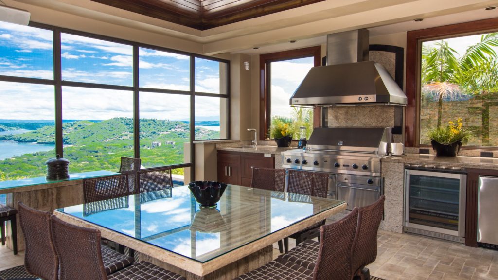 This Kitchen space will have you amazed by the views. Nice comfortable chairs to sit in as you take in all the views. Inspiring to say the least, Enjoy these beautiful views.