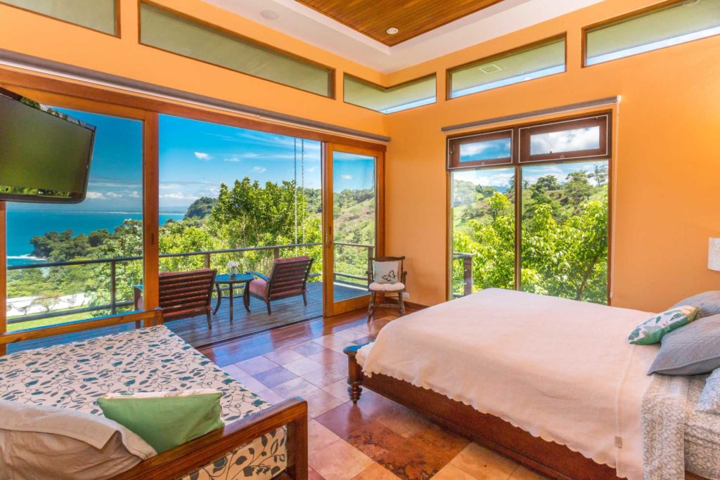 The stunning master suite has a private balcony with ocean view, ensuite bathroom, a king bed, and a twin.