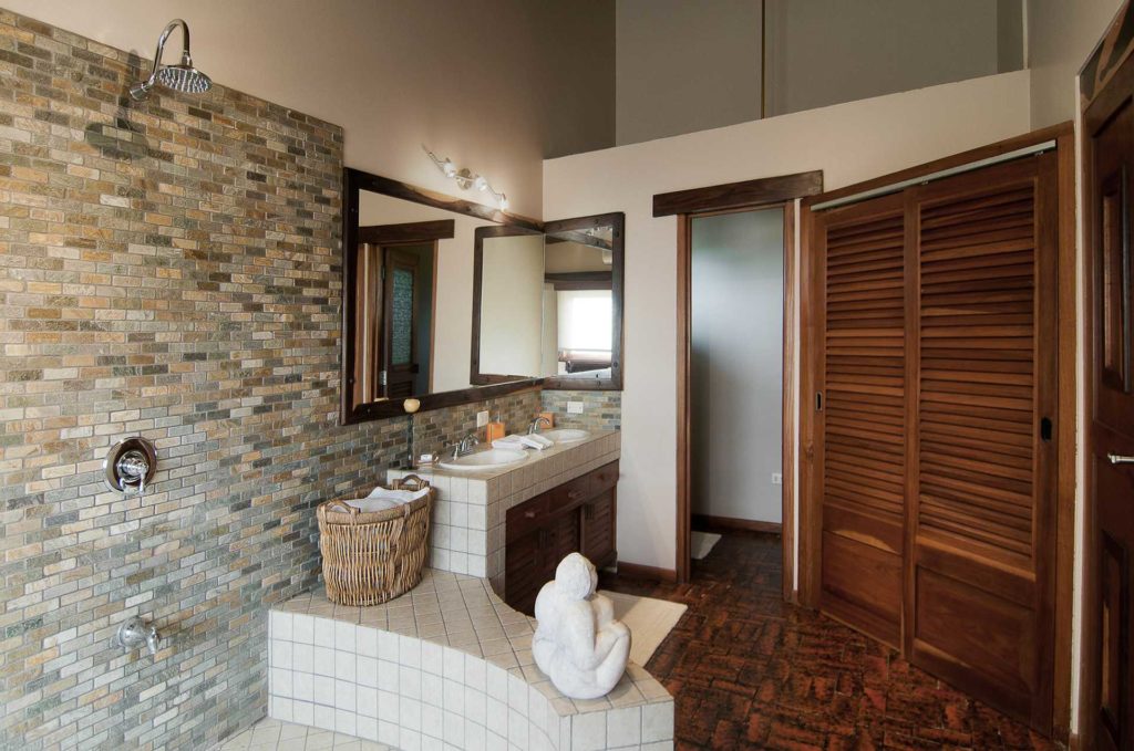 Each bathroom is uniquely-designed. Tiled floors and clean tiled shower lines are exceptional