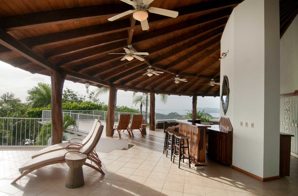 Entertaining is a breeze on the huge terrace on the top level of  this deluxe ocean view villa in Playa Flamingo
