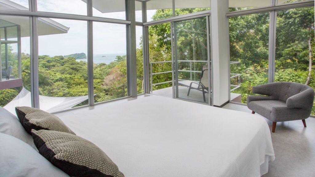 This stunning queen bedroom has an amazing wrap-around view and private balcony.