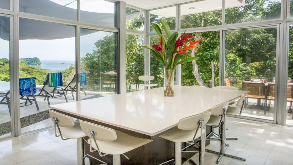 Floor-to-ceiling glass walls in the dining area create an amazing back-to-nature dining experience.