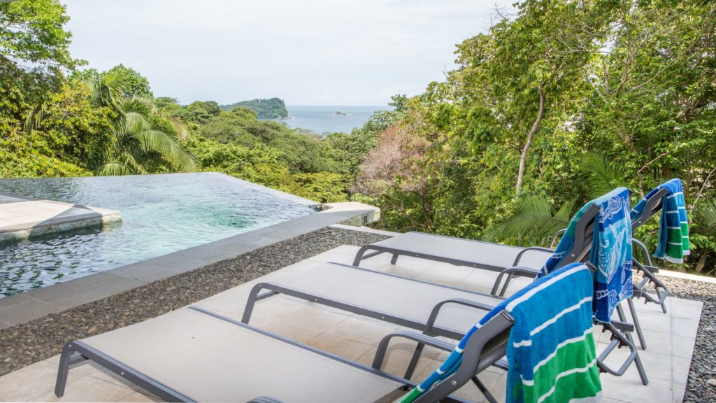 The infinity pool protrudes out over the cliff to provide an awesome view of the ocean and rainforest treetops.