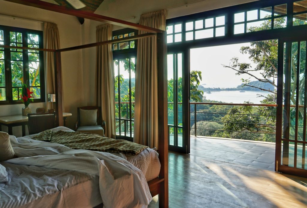 Step out of this bedroom onto a private balcony with an incredible ocean view. 
