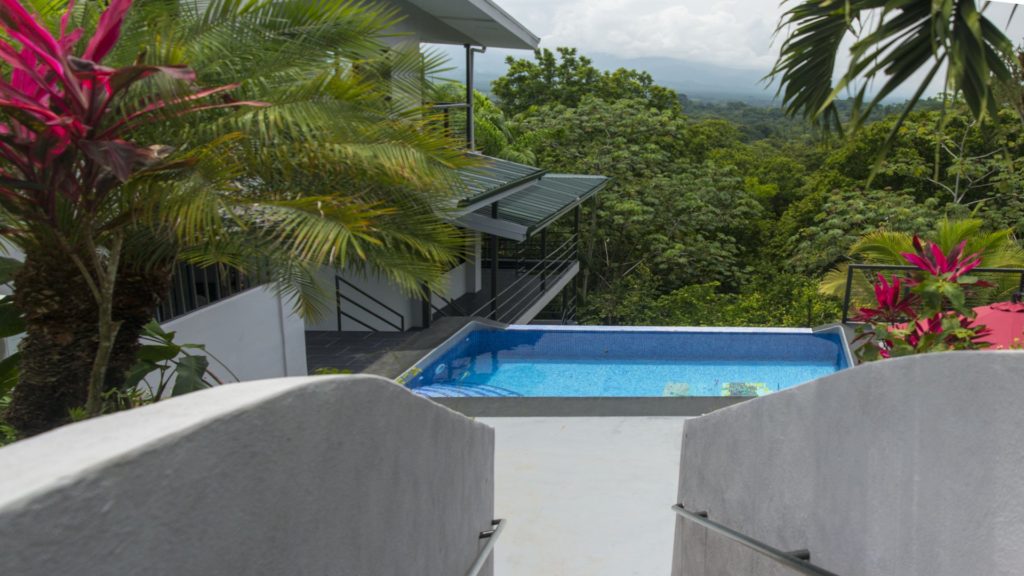 This refreshing infinity pool looks out over the lush jungle canopy.
