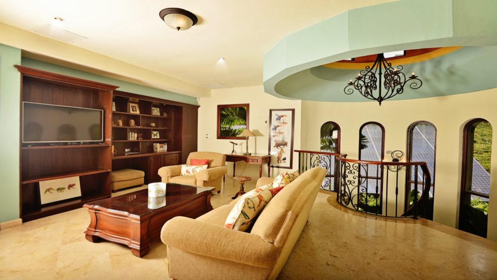 Plush seating allows for television viewing in this setting, fostering quality time with family.