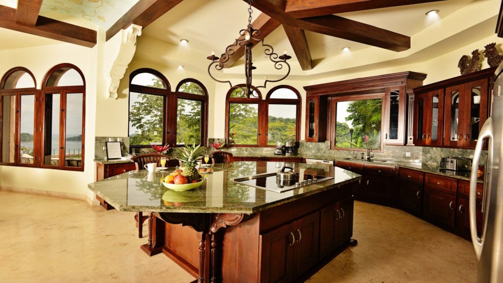 Embrace the joy of cooking and sharing meals in this elegant, fully equipped kitchen. The tropical garden views provide a serene and picturesque setting for your culinary escapades.