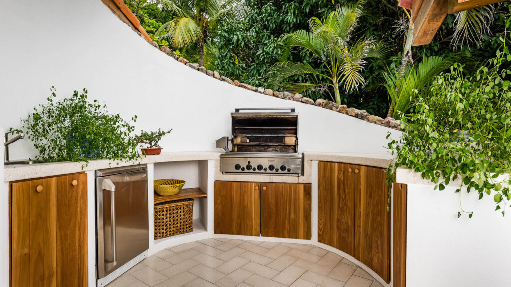 This barbecue station has a sink and fridge to store fresh meats or your cold beverages.