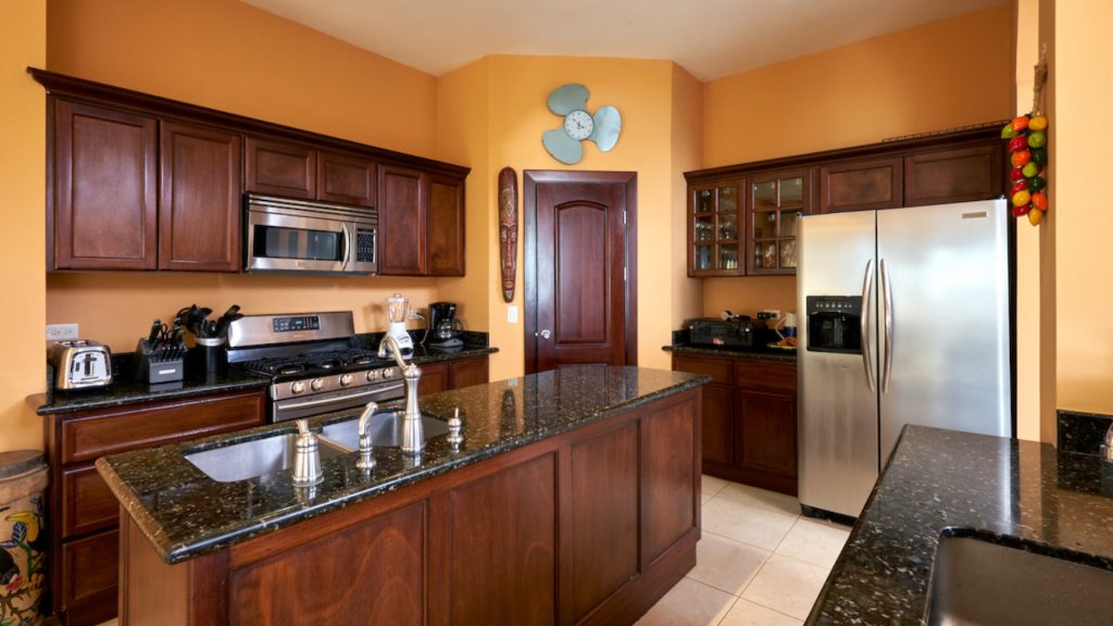 Fully equipped kitchen with modern appliances.