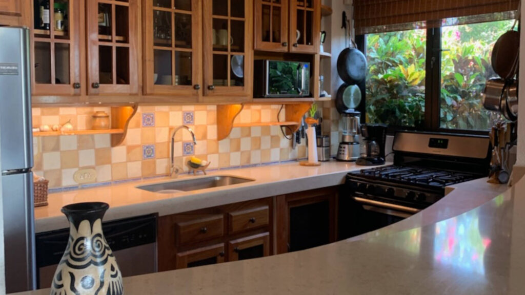 This lovely kitchen is outfitted with state-of-the-art appliances and beautiful stone counter tops.