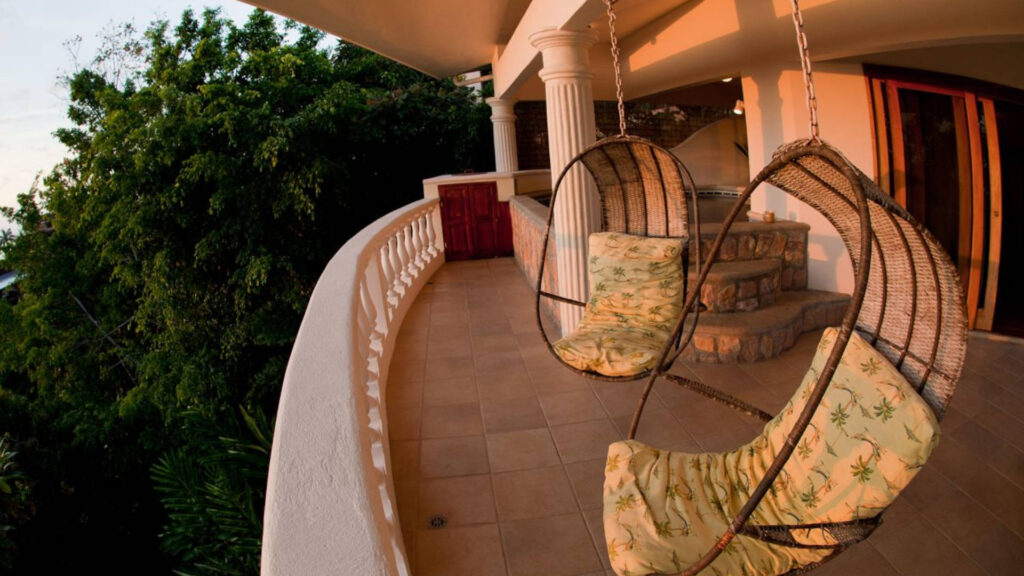 These chairs hanging on the porch area give you a feeling of floating above the treetops of the rainforest canopy.