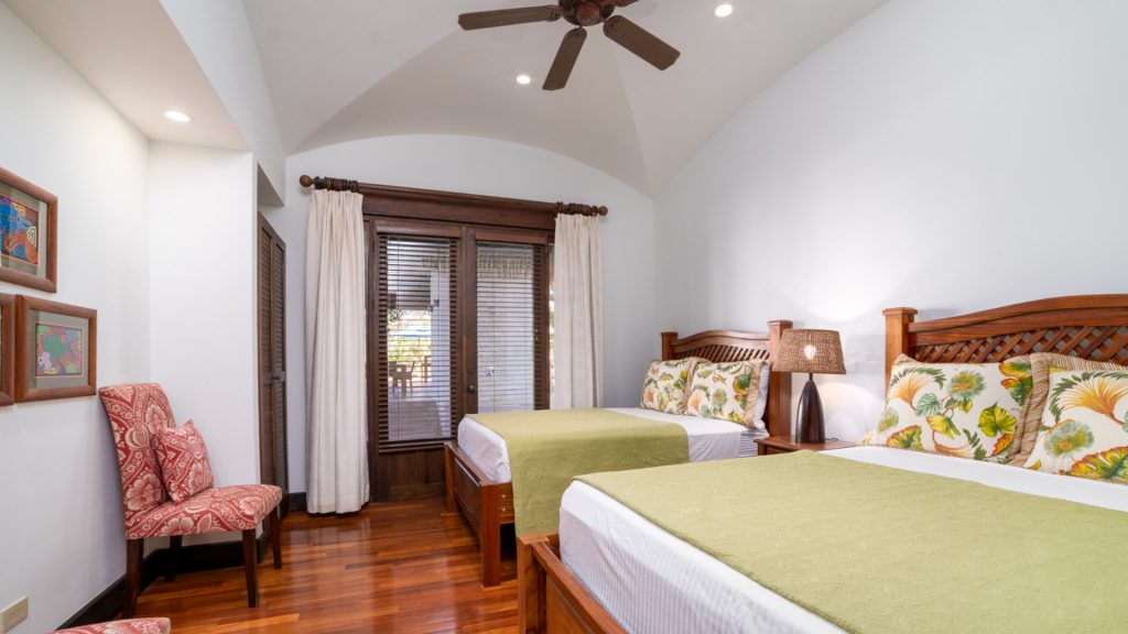 This room has twin beds and ceiling fans to keep cool at night.