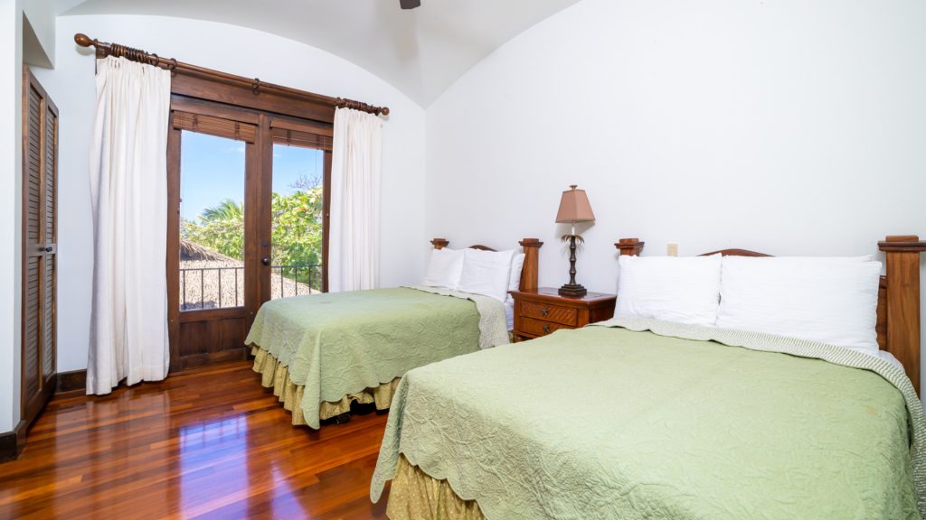 This room has double beds and is beautifully appointed. 