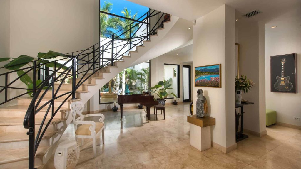 A lovely curved stairway leading to the upper part of your villa. 
