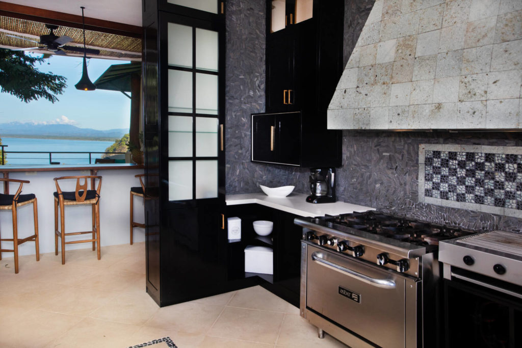At one end of the modern gourmet kitchen is the perfect spot to enjoy your fresh morning coffee with a view.