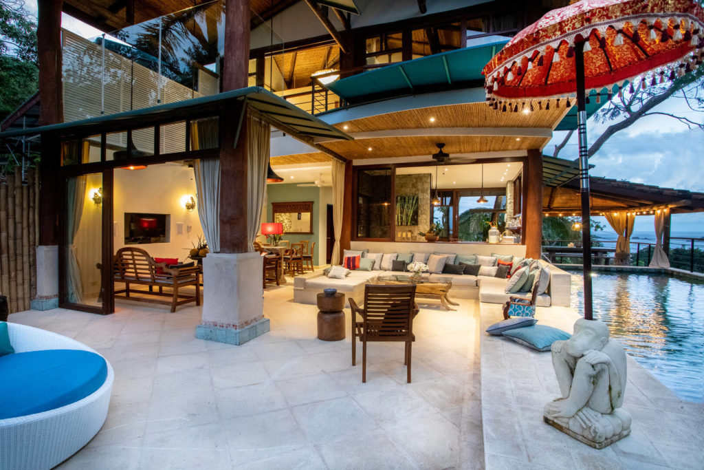 Huge natural wood columns, cool stone pavings, handcrafted cane ceilings. This villa is a design masterpiece.