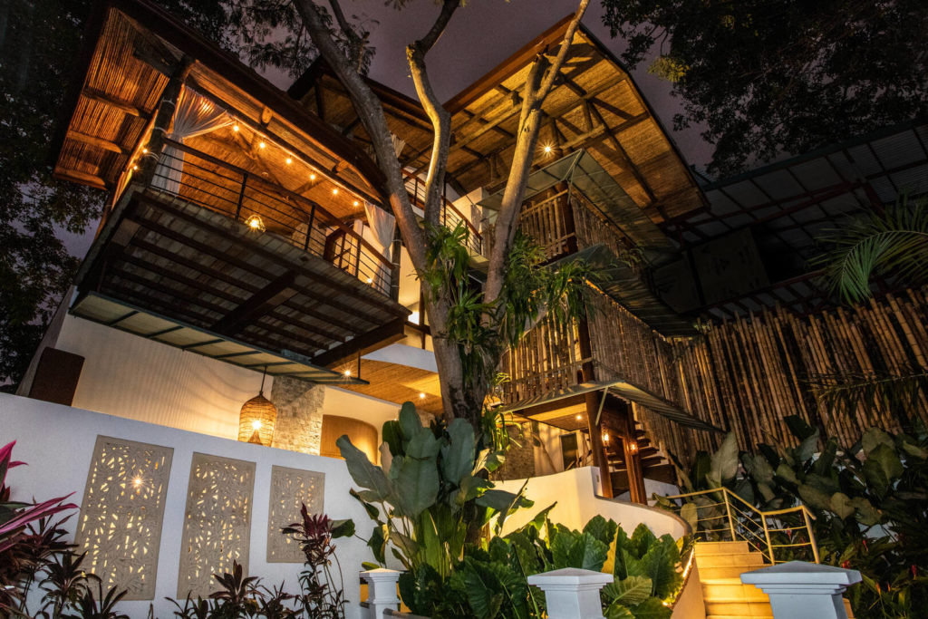 An orchid-covered tree forms part of the structure of this stunning luxury villa in the heart of Manuel Antonio.