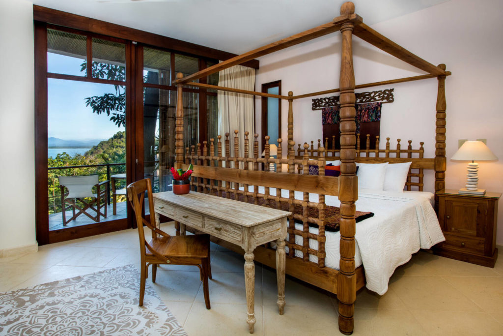 Sleep soundly in this beautiful hand-carved king poster bed and in the morning step out onto an amazing private balcony.