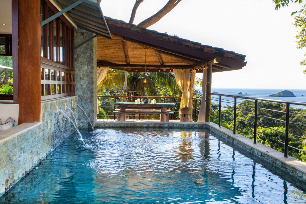 The pool has a relaxing ambience with rustic natural stone and the sound of the water spouts.