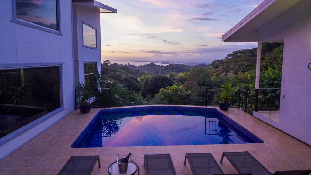 Evenings are magical when sitting by the pool with this amazing view of rainforest and ocean.