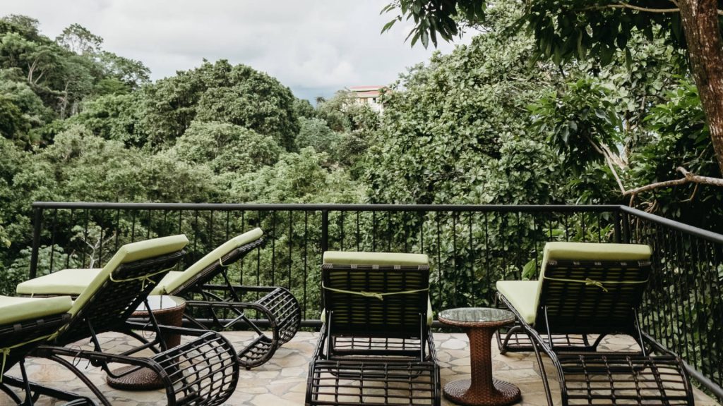 Comfortable loungers allow you to watch the pool and the rainforest surrounding the property.