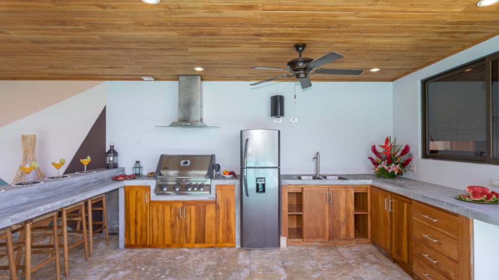 Nothing beats the convenience of a poolside BBQ and kitchen with bar seating and a dining area.