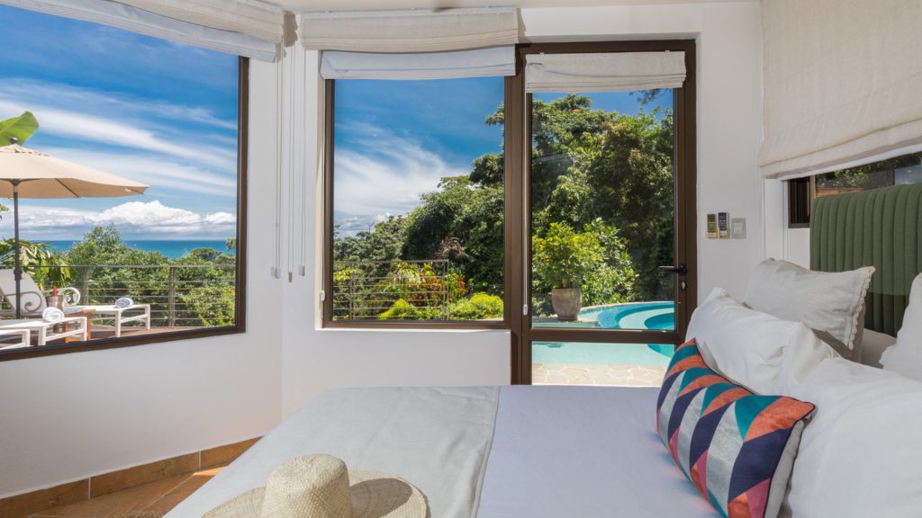This bedroom is located poolside with an outstanding view, king bed, and ensuite bathroom.