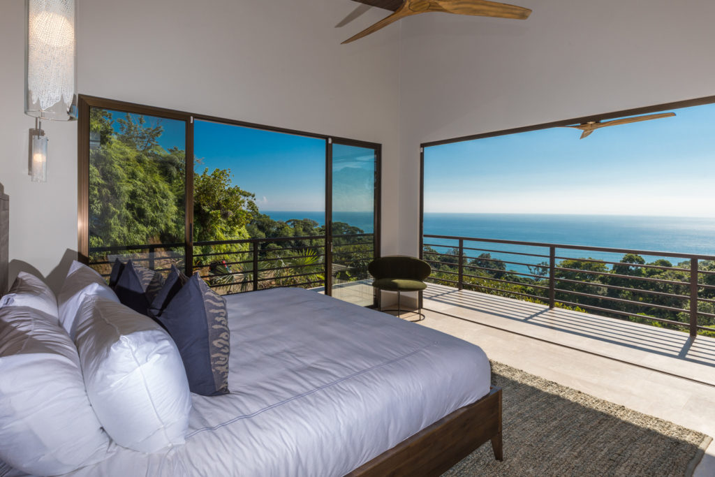 Wake up to endless views of crystal blue water from the master bedroom.