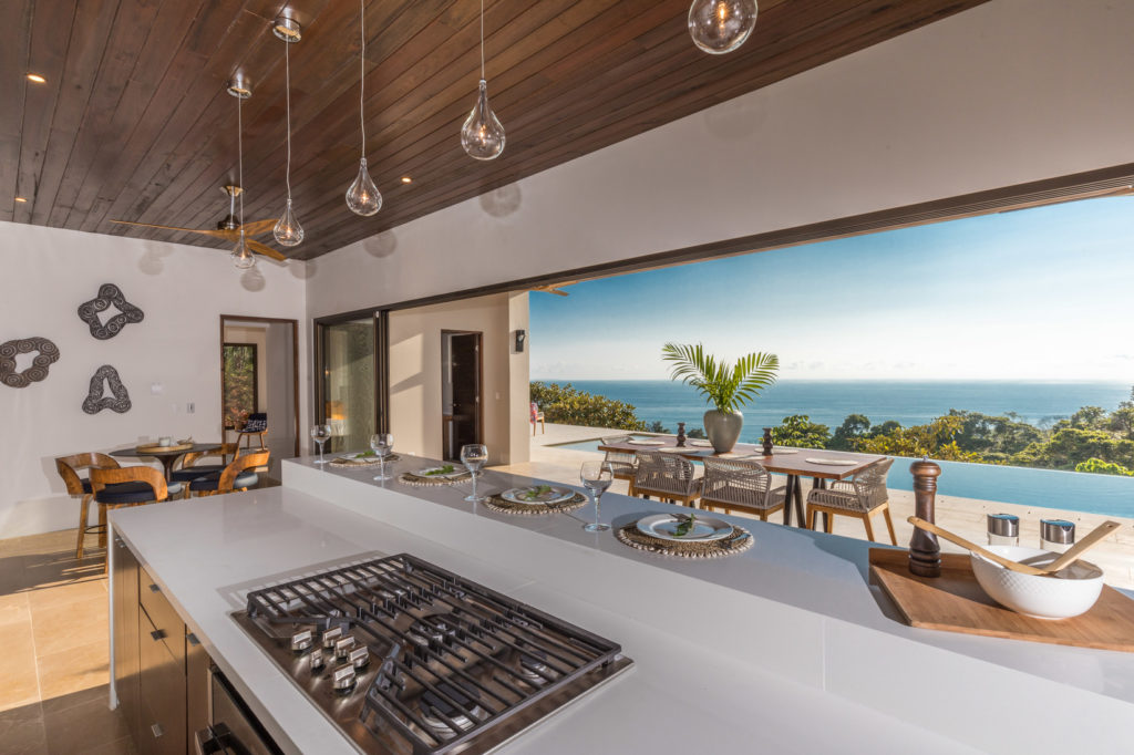 Look up and enjoy the ocean views while preparing a scrumptious meal in the modern kitchen.