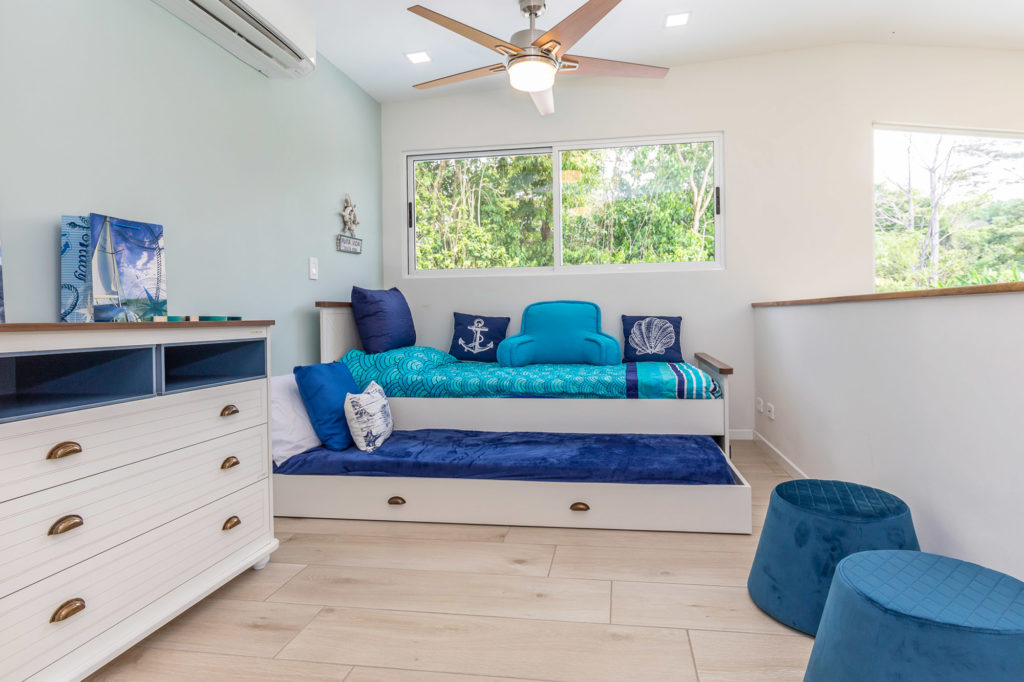 Stay cool in the nautically decorated sleeping loft, equipped with air conditioning and ceiling fans.