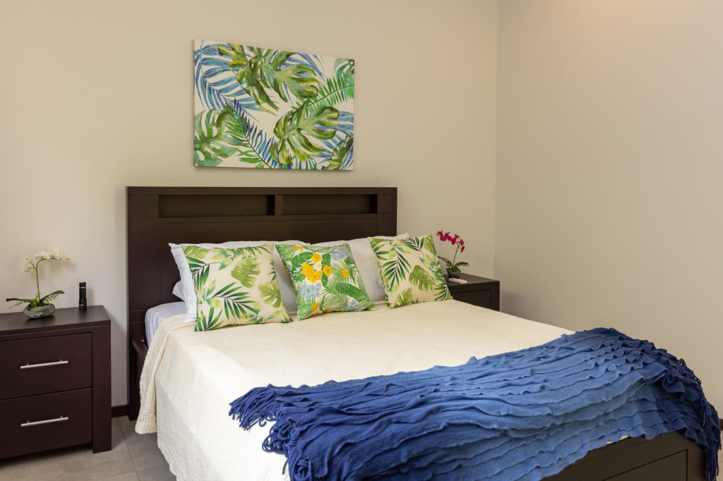 A touch of the tropics is incorporated in the bedroom decor. 
