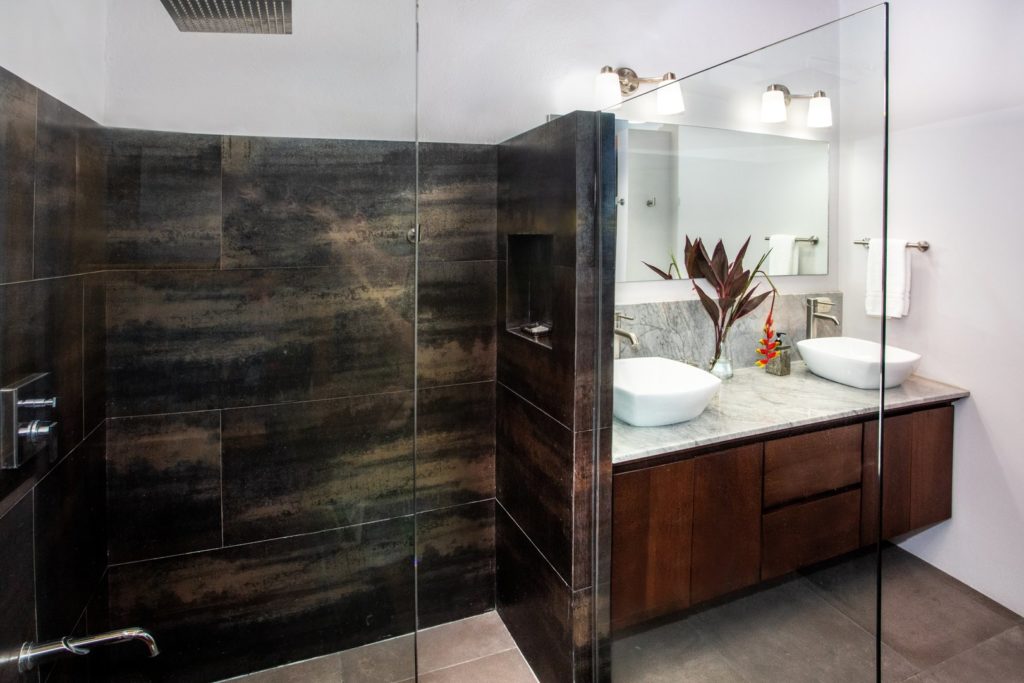 An exquisite shower and his and hers sinks are features in this beautifully-designed bathroom.