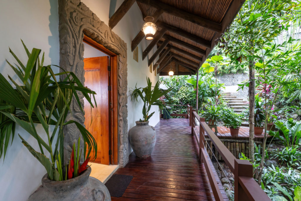The villa is surrounded by beautiful gardens.