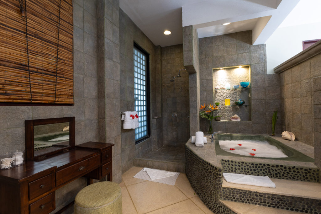 The spacious master ensuite bathroom includes a separate shower and a luxurious tub adorned with elegant fixtures.