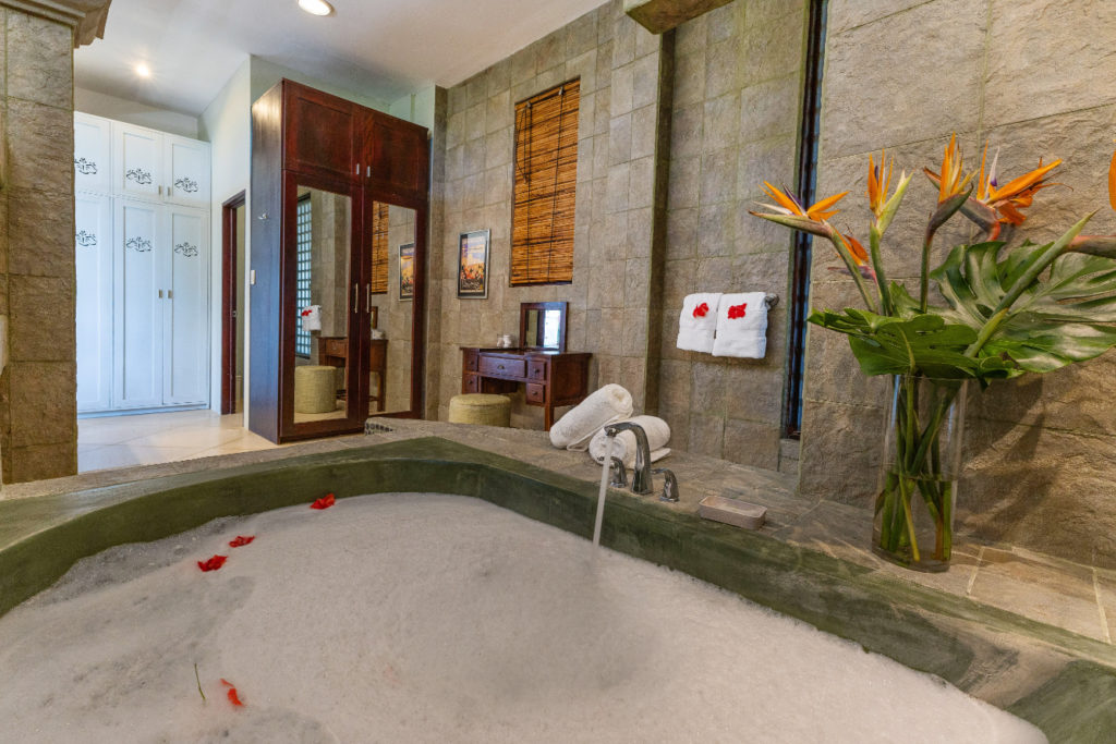 Indulge in the expansive bathtub.